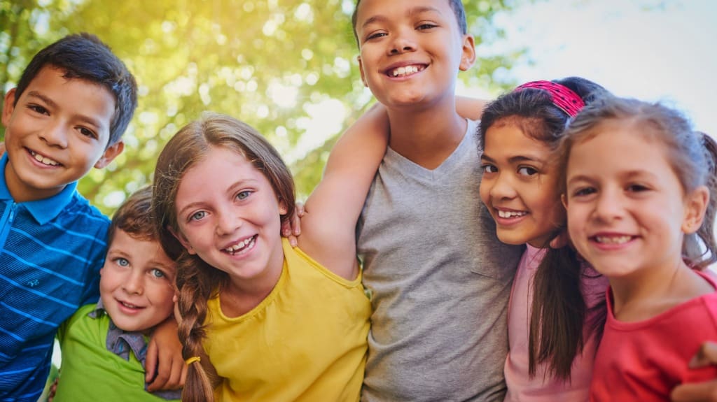 Kids Playing Together in the Backyard - Playset Transformations